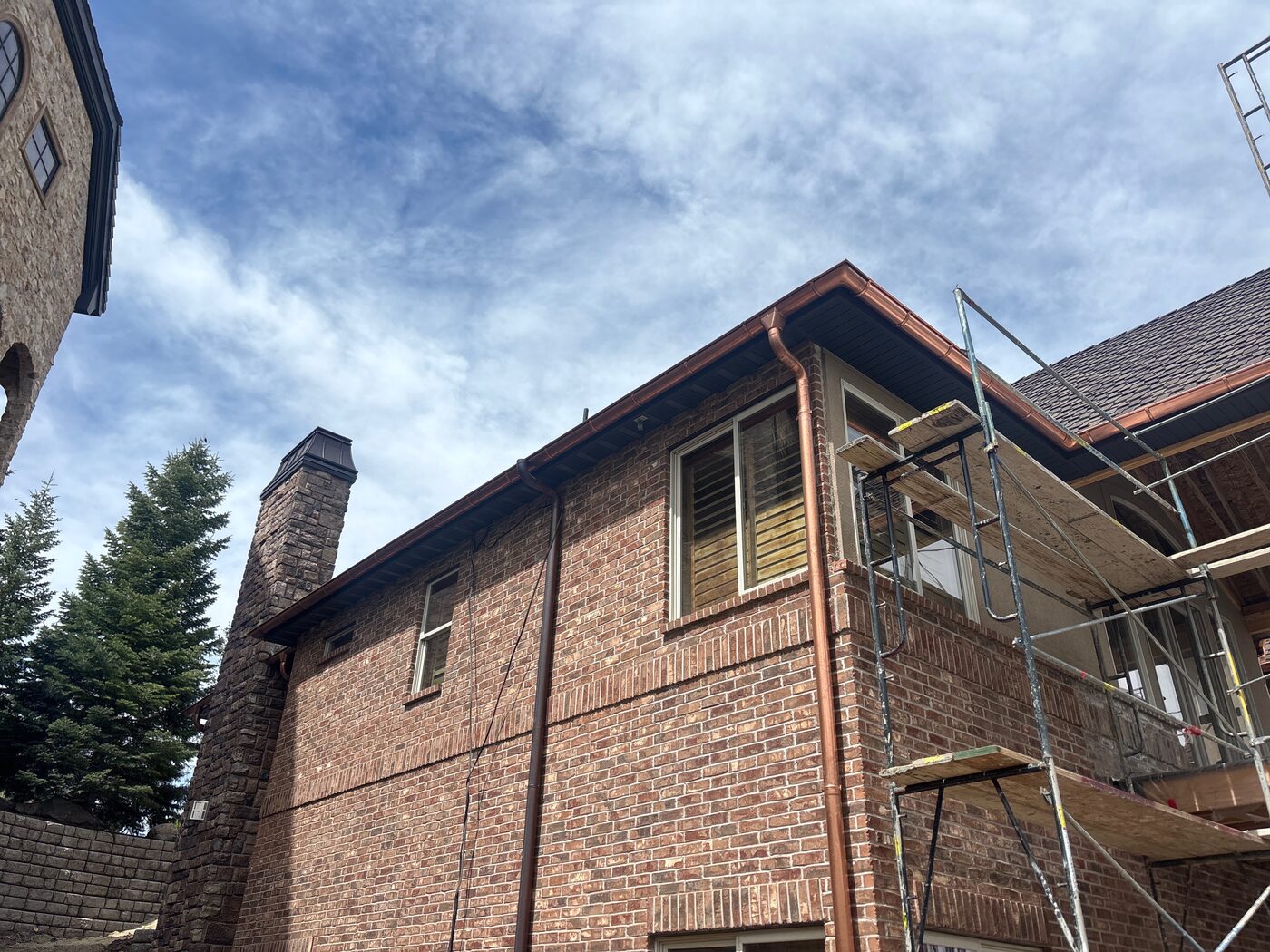 Copper gutter installation — Utah mountains