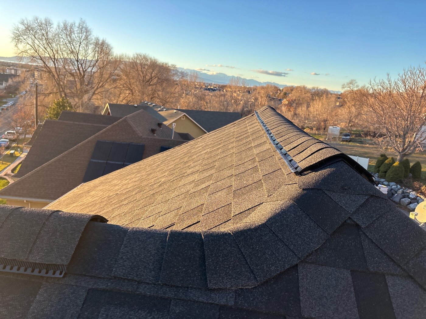 Commercial TPO flat roof — snowy Wasatch Mountains